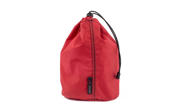 A Size 3 Sangria (red with light red grid) 210 Cerylon Travel Stuff Sack.